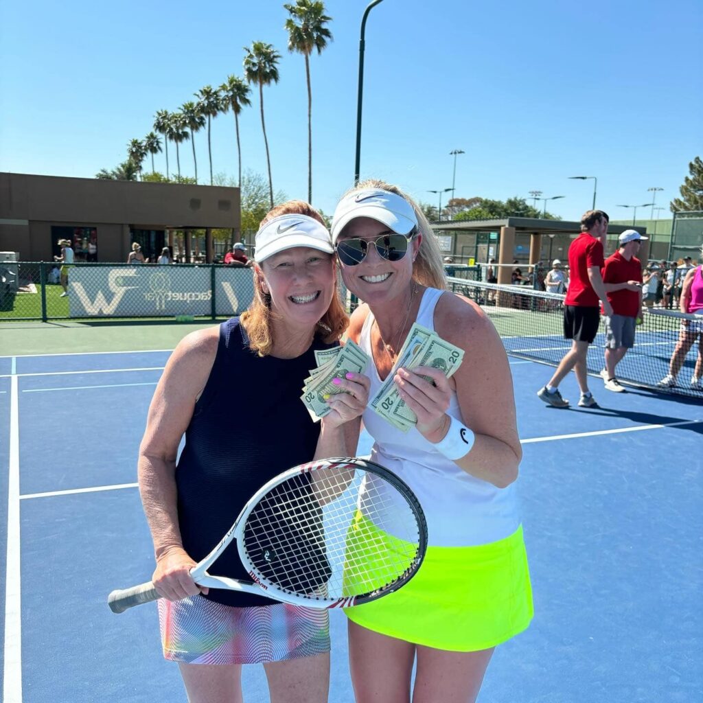 Womens doubles tennis team wins money.